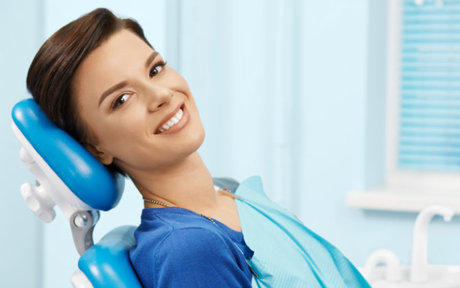 smiling woman in a dental chair