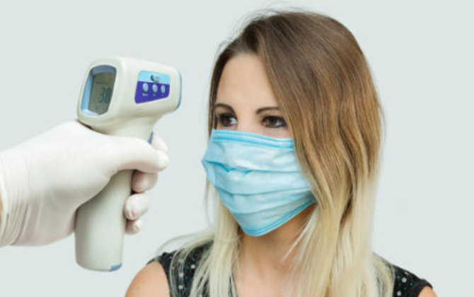 temperature check before dental appointment at Buford Family Dental